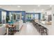 Spacious open-concept living room with a dining area and large kitchen island for entertaining at 2009 Tropical Palms Cir, Kissimmee, FL 34747