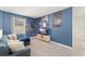 Spacious living room featuring a blue accent wall and contemporary décor at 2009 Tropical Palms Cir, Kissimmee, FL 34747