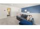 Cozy living room with plush seating and vibrant blue accent wall at 2009 Tropical Palms Cir, Kissimmee, FL 34747