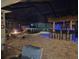 Inviting backyard featuring a hot tub, tiki bar, outdoor kitchen, and fire pit, perfect for entertaining guests at 2174 Timber Creek Ln, Clermont, FL 34715