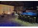 Relaxing outdoor area featuring a hot tub, fire pit, and comfortable seating, great for unwinding after a long day at 2174 Timber Creek Ln, Clermont, FL 34715