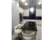 Sleek kitchen with a large island, white cabinetry, and granite countertops at 2300 Painter Ln, Kissimmee, FL 34741