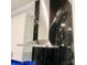 Sleek LG stainless steel range hood with black marble backsplash and white cabinets at 2300 Painter Ln, Kissimmee, FL 34741