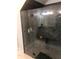 Sleek bathroom shower boasts a glass door, marble tile, and built-in shelving at 2300 Painter Ln, Kissimmee, FL 34741