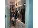 Organized walk-in closet with custom shelving, hanging rods, and ample storage space at 2300 Painter Ln, Kissimmee, FL 34741