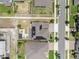 An aerial view of the property, showing the fenced-in backyard, the roof, the street, and the neighbor's house at 2751 Matera Dr, St Cloud, FL 34771