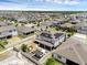 Aerial view showing solar panels, fenced backyard with patio and pergola, and the surrounding neighborhood at 2751 Matera Dr, St Cloud, FL 34771