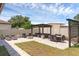 Backyard featuring an outdoor lounge area, fire pit, dining table, and well-maintained landscaping at 2751 Matera Dr, St Cloud, FL 34771