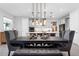Bright dining area featuring contemporary lighting fixture and an open layout to the kitchen at 2751 Matera Dr, St Cloud, FL 34771
