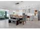 Elegant dining area with stylish pendant lighting, flowing seamlessly into a modern kitchen space at 2751 Matera Dr, St Cloud, FL 34771