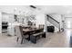 This dining area features a modern table with decorative accents and an open floor plan with plenty of natural light at 2751 Matera Dr, St Cloud, FL 34771