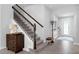 Welcoming foyer with tiled floor and staircase adjacent to front door, leading to upper level at 2751 Matera Dr, St Cloud, FL 34771