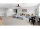 This living room features neutral decor, a large sectional sofa, a dining area and statement art at 2751 Matera Dr, St Cloud, FL 34771