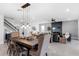 Open floor plan with dark wood dining table and living room with built in fire place at 2751 Matera Dr, St Cloud, FL 34771