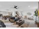 Open-concept living room with elegant decor that flows seamlessly to other parts of the home at 2751 Matera Dr, St Cloud, FL 34771