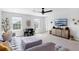 This living room features neutral decor, a large sectional sofa, a dining area and an entertainment center at 2751 Matera Dr, St Cloud, FL 34771