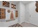 Well-organized mudroom with cubbies, seating, and stylish decor at 2751 Matera Dr, St Cloud, FL 34771