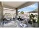 Covered patio showcasing outdoor seating including lounge chairs and egg chairs overlooking the backyard at 2751 Matera Dr, St Cloud, FL 34771