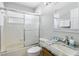 Well-maintained bathroom featuring combination shower and bathtub with tiled walls at 3016 Samosa Hill Cir, Clermont, FL 34714