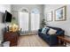 Cozy bedroom featuring natural light, a comfortable sitting area, and carpeted floors at 3016 Samosa Hill Cir, Clermont, FL 34714