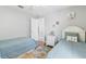 Lovely guest bedroom with two twin beds, hardwood floors, and closet at 3016 Samosa Hill Cir, Clermont, FL 34714