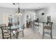 Bright breakfast nook with chandelier offers seamless access to a covered patio at 3016 Samosa Hill Cir, Clermont, FL 34714