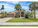 Beautiful single-Gathering home with a well-kept lawn and mature palm trees at 3016 Samosa Hill Cir, Clermont, FL 34714
