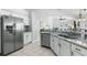 Modern kitchen with granite countertops and stainless steel appliances at 3016 Samosa Hill Cir, Clermont, FL 34714