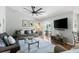 A well-lit living room offers comfortable seating and a view of the refreshing pool area at 3016 Samosa Hill Cir, Clermont, FL 34714
