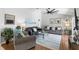 Spacious living room with hardwood floors, vaulted ceiling and comfortable seating arrangement at 3016 Samosa Hill Cir, Clermont, FL 34714