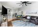 Open-concept living room showcases great connectivity with the kitchen and a large TV at 3016 Samosa Hill Cir, Clermont, FL 34714
