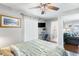 Comfortable main bedroom with hardwood floors and connected bathroom at 3016 Samosa Hill Cir, Clermont, FL 34714