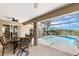 Inviting screened-in pool with patio dining, lounge chairs, and lush landscaping for a relaxing outdoor experience at 3016 Samosa Hill Cir, Clermont, FL 34714