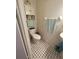 Small bathroom featuring black and white tile floor, toilet, and cabinet at 3327 Toasy Dr, Orlando, FL 32806