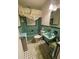 Retro bathroom features tile walls, black and white tile floor, and vintage-style fixtures at 3327 Toasy Dr, Orlando, FL 32806