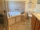 Comfortable bathroom boasts relaxing tub, shower, vanity, and toilet at 3327 Toasy Dr, Orlando, FL 32806