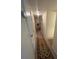 Inviting hallway features long decorative rug, neutral paint and complementary furniture at 3327 Toasy Dr, Orlando, FL 32806