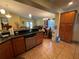 Spacious kitchen features granite countertops, stainless steel dishwasher and tiled flooring at 3327 Toasy Dr, Orlando, FL 32806