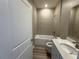 Well-lit bathroom with tub, shower, white vanity, and modern fixtures at 4009 Maggie Loop, Lakeland, FL 33813
