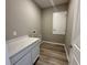 Well-organized laundry room includes counter space, storage cabinets, and connections for washer and dryer at 4009 Maggie Loop, Lakeland, FL 33813