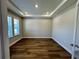 Bright office space featuring wood flooring and ample natural light from large windows at 4015 Maggie Loop, Lakeland, FL 33813