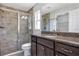 Bathroom featuring a large glass shower with tile surround, granite vanity, and tile floors at 4126 Sw 132Nd Ln, Ocala, FL 34473