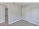 Bedroom with neutral walls, plush carpet and double-door closet at 4126 Sw 132Nd Ln, Ocala, FL 34473