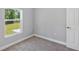Bedroom with plush carpet and a window that provides great natural light at 4126 Sw 132Nd Ln, Ocala, FL 34473