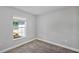 A bright bedroom with neutral walls, plush carpet and a window with blinds at 4126 Sw 132Nd Ln, Ocala, FL 34473