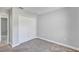 Bedroom with neutral walls, plush carpet and double-door closet at 4126 Sw 132Nd Ln, Ocala, FL 34473