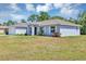 Charming single-story home with well-maintained lawn and landscaping with two-car garage at 4126 Sw 132Nd Ln, Ocala, FL 34473