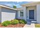 Close-up of front porch with nice landscaping and plants around the front at 4126 Sw 132Nd Ln, Ocala, FL 34473