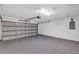 Spacious two-car garage with smooth gray epoxy flooring and an automatic door at 4126 Sw 132Nd Ln, Ocala, FL 34473