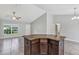 Kitchen island featuring granite countertop, dark wood cabinetry, and tile flooring at 4126 Sw 132Nd Ln, Ocala, FL 34473